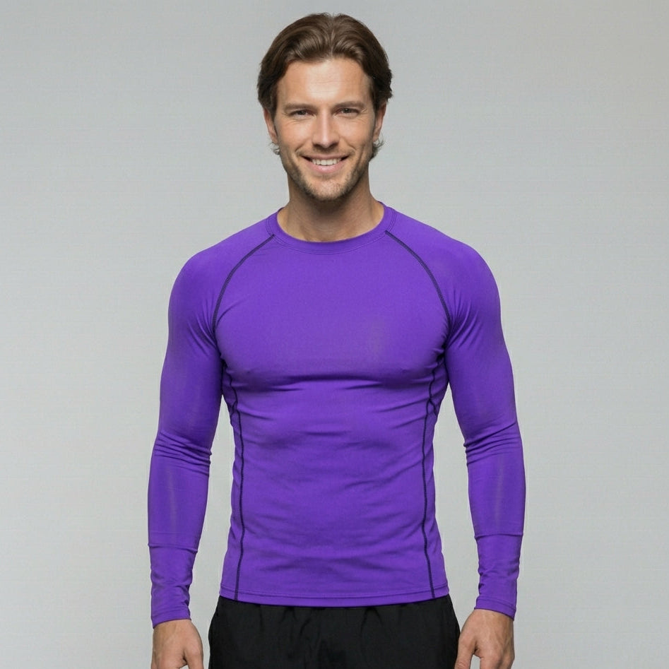 Man wearing a purple long-sleeve athletic shirt on a gray background