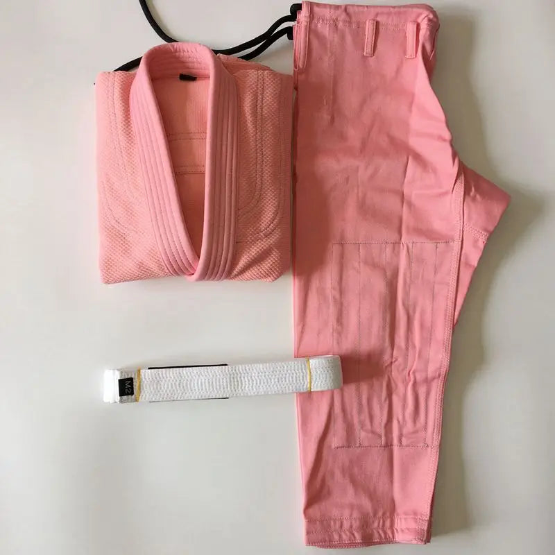 Pink BJJ Gi with a white belt on a light gray background